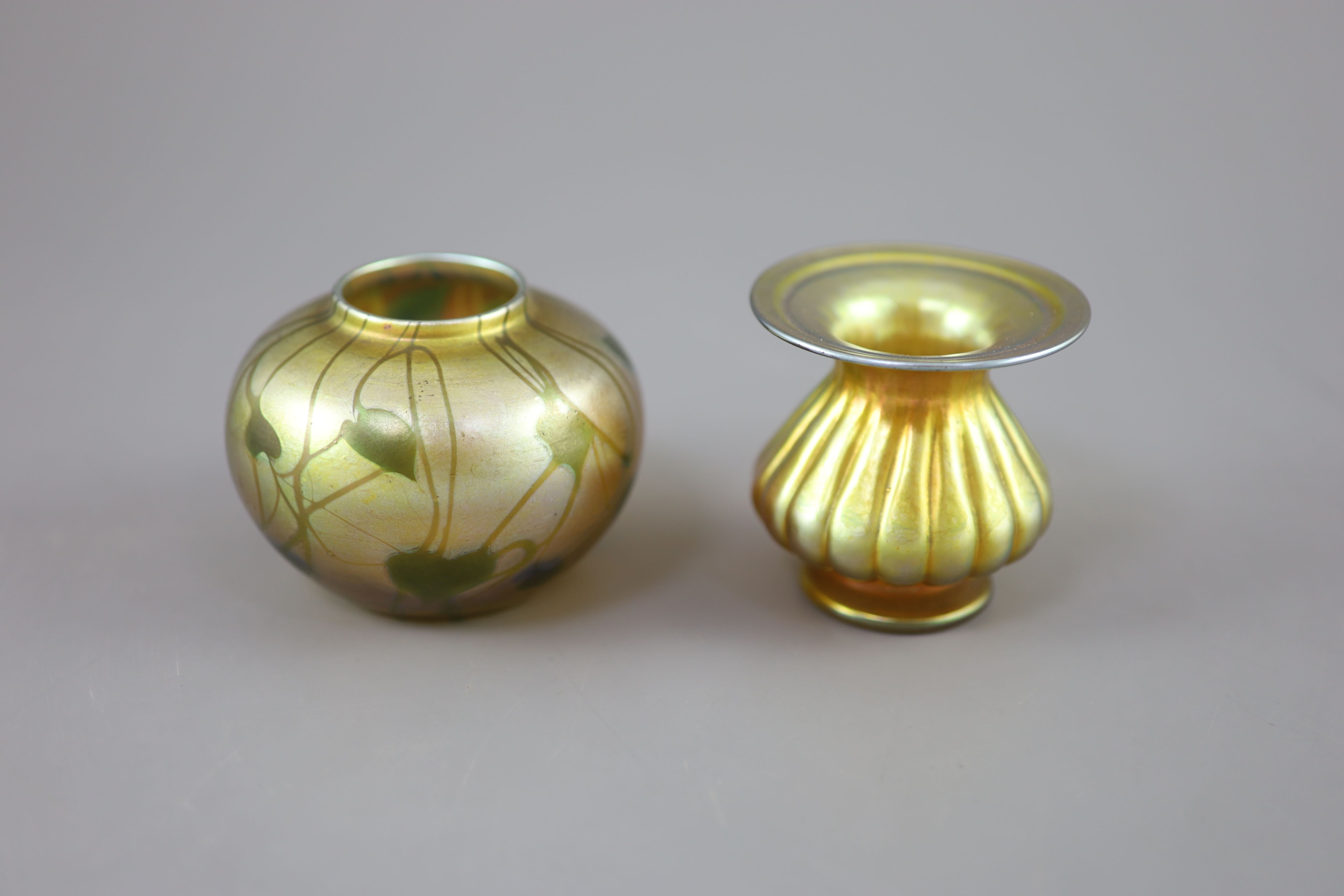 A Tiffany vine leaf pattern favrile iridescent glass vase and a Tiffany favrile lobed vase, early 20th century,